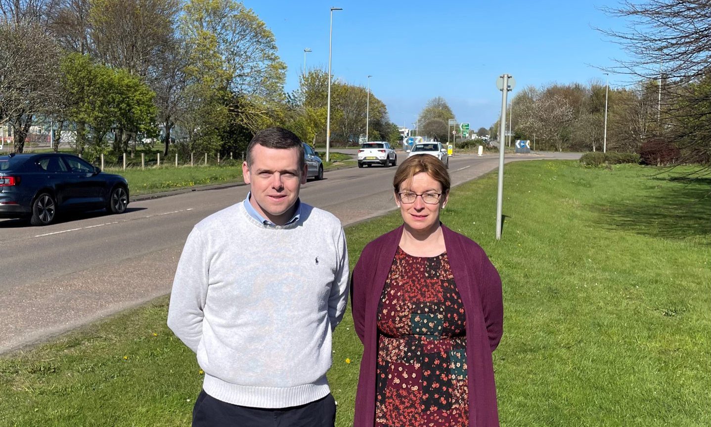 Douglas Ross and Kathleen Robertson next to A96 in Forres.