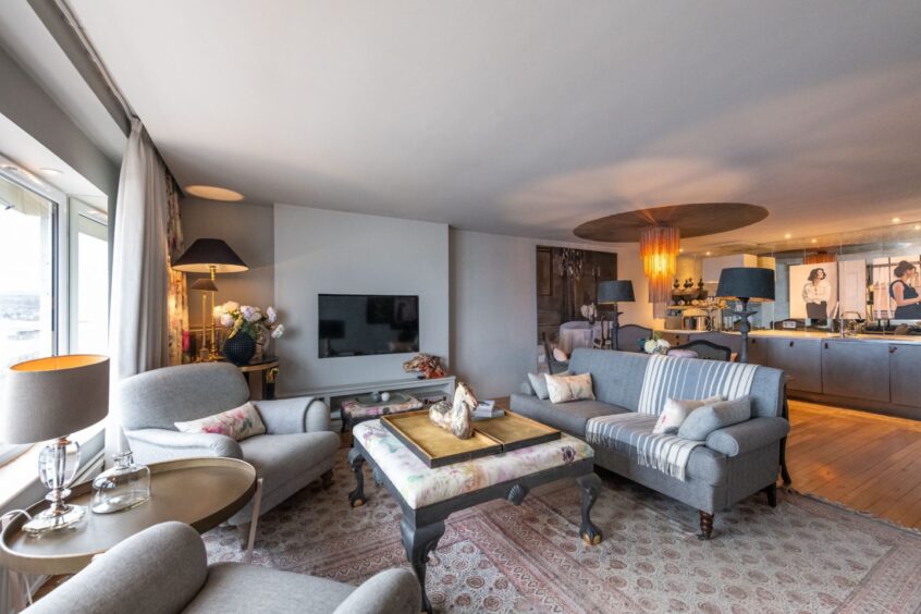 Open plan lounge, kitchen and dining area in the Stonehaven flat renovation.