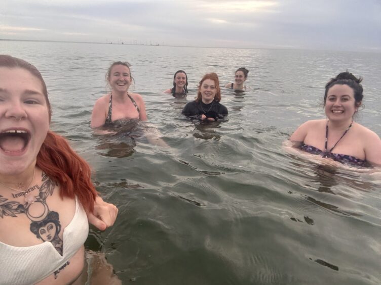 Mya Lorimer with women from her cold water dipping group.