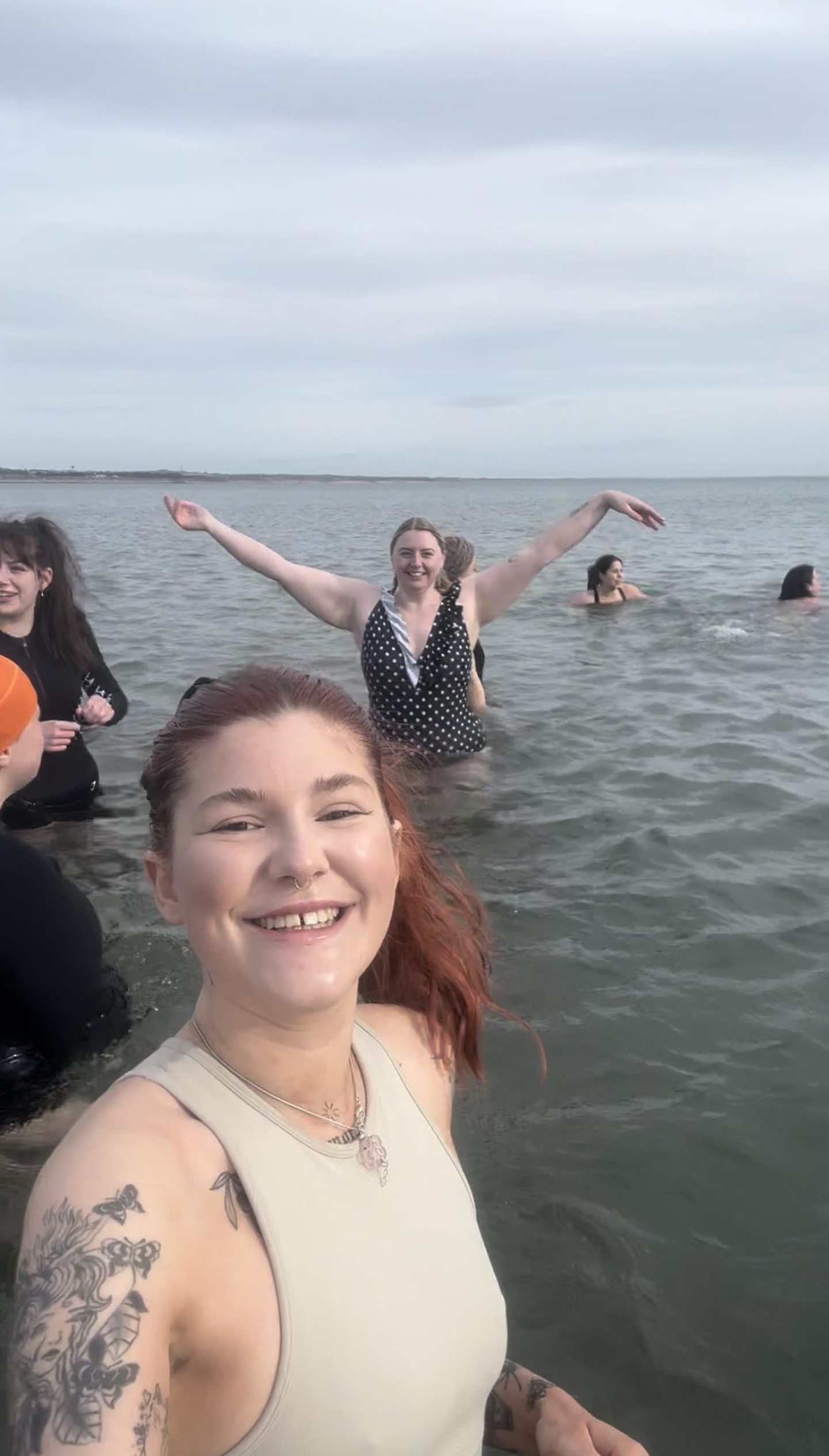 Group of women enjoying cold water dipping at Aberdeen Beach.