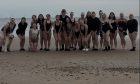 The Granite Sea Girls group are pictured at Aberdeen Beach before heading into the chilly water.