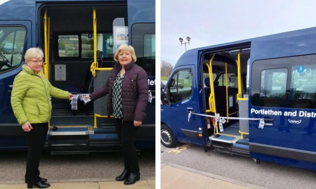 Sheila Godsman and Lyn King cut ribbon for new ambulance