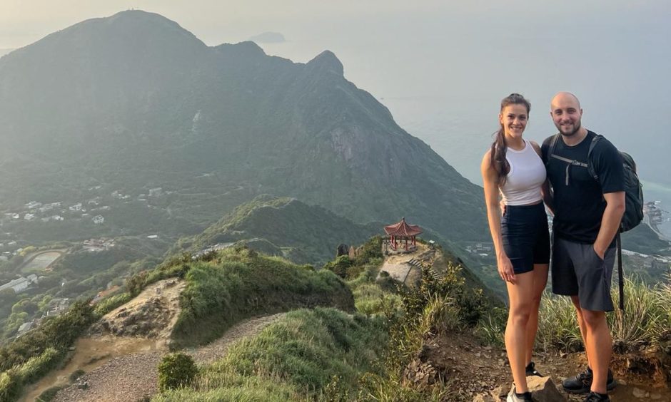 Sonya and Danny Taylor standing on top of mountain on Taiwan.