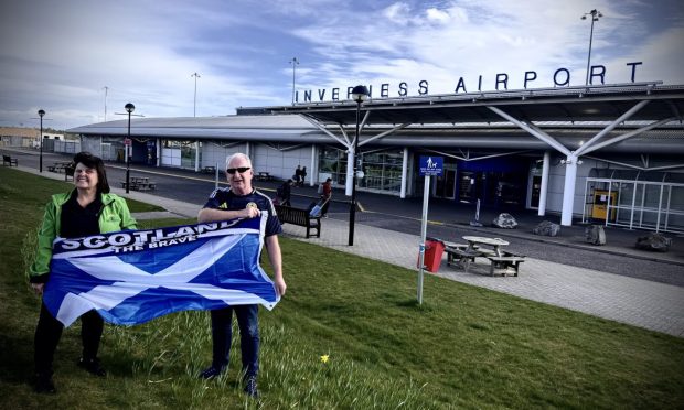 Julia MacLeay, owner of Spirit Journeys, and Don Lawson, Inverness Bid director, are ready to wave off the Euros-bound charter flight from Inverness Airport.