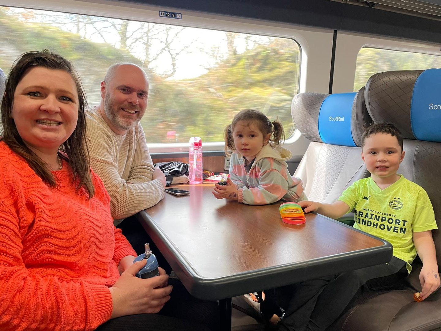 The Scott family on the train on the Harry Potter line.