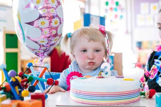 Isabella Winfield blows out her candles as she celebrates her third birthday at Ladybird Development Group Nursery in Lossiemouth.