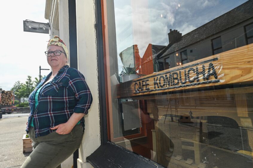 Sarah Borthwick outside Cafe Kombucha before closure.