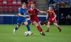Aberdeen Women midfielder Eilidh Shore comes up against Montrose forward Charlotte Gammie in a SWPL match.