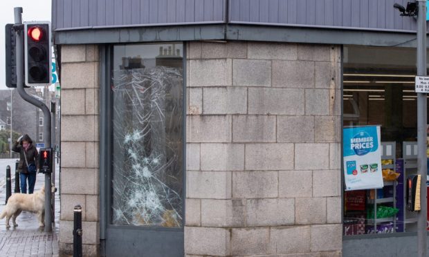 Smashed window, Co-op Rosemount.