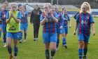 Caley Thistle Women manager Karen Mason and the players applaud the crowd after a Scottish Cup match against Rangers.