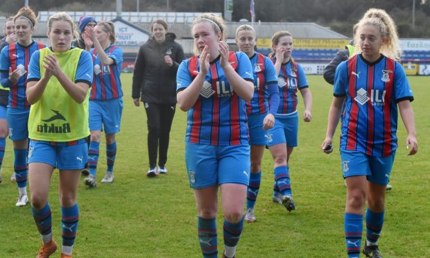 Caley Thistle Women manager Karen Mason and the players applaud the crowd after a Scottish Cup match against Rangers.