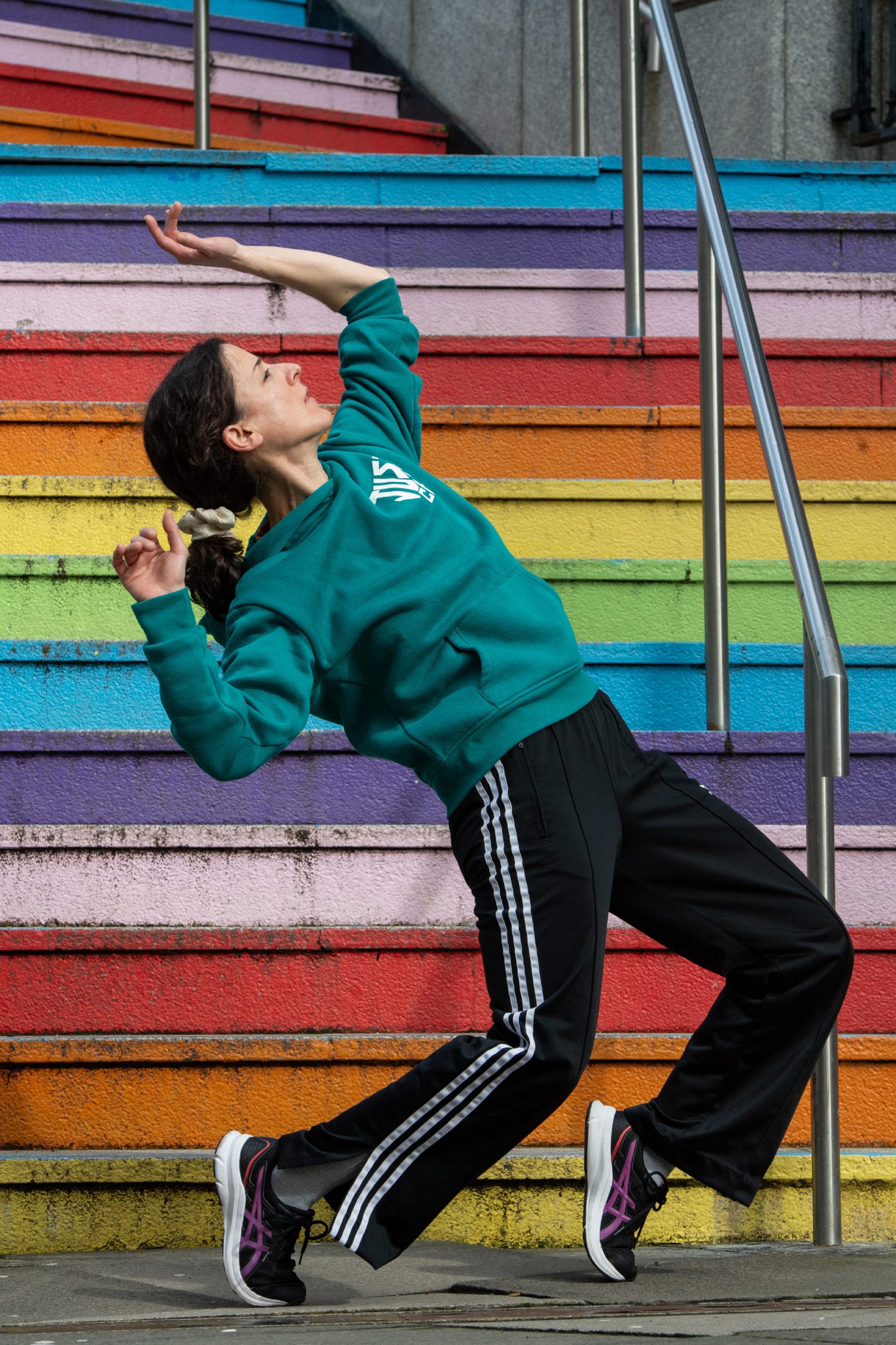 Sofia Kondylia, who runs adult dance classes in Aberdeen, does a dance move on some coloured outdoor stairs