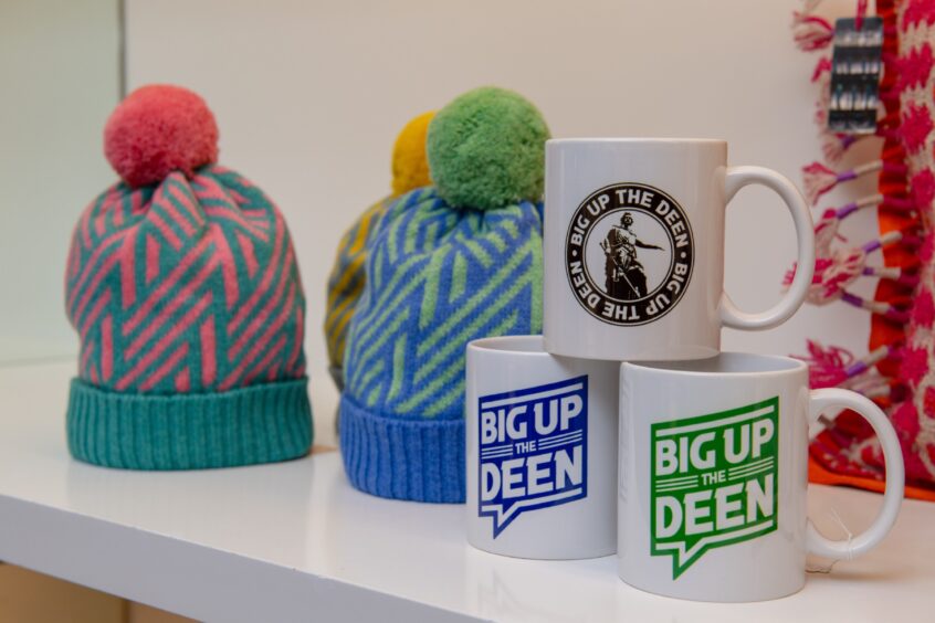 Bobble hats and Aberdeen mugs on display in EDIT