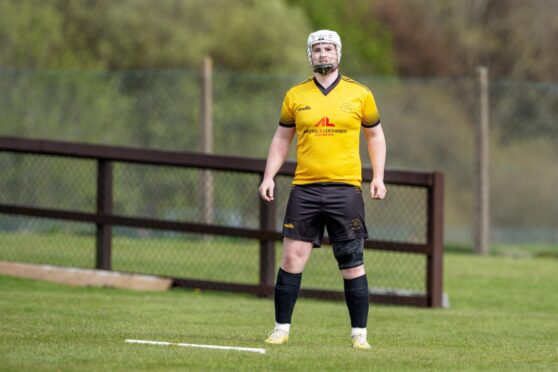 Malcolm Clark suffered an ankle injury in Oban Camanachd's cup win