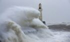 Waves in front of lighthouse