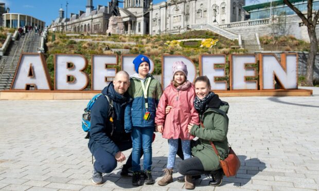 Tourists Arne, Leo, Emilia, and Franziska Guenther at Union Terrace Gardens.