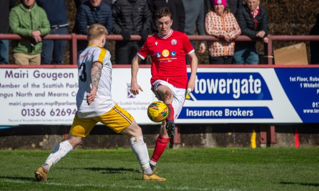 Huntly's Ross Still, left, battles with Inverurie's Greg Mitchell