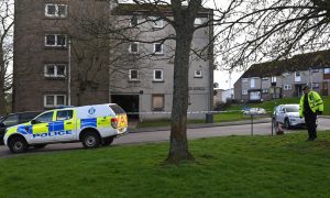 The block of flats on Tillydrone's Auchinleck Road was sealed off while officers investigated the death. Image: Kami Thomson / DC Thomson