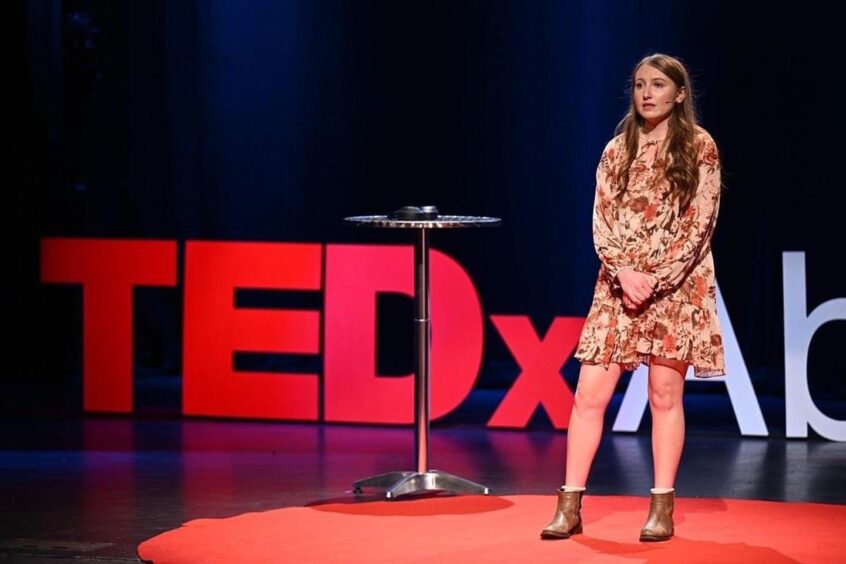 Katie Forbes delivering her TEDx talk - Autism is a difference, not a disorder - in Aberdeen