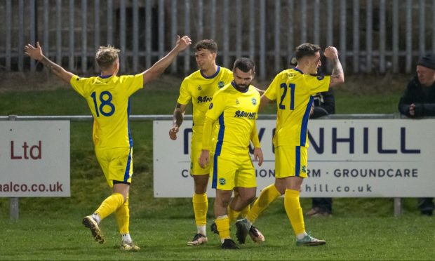 Joe McCabe, second from left, celebrates with his team-mates Jack MacIver, left, Andrew MacAskill, third from left, and Dale Wood after netting Buckie Thistle's third goal against Keith. Pictures by Jasperimage.