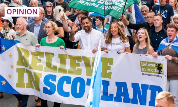 First Minister of Scotland Humza Yousaf (centre) and co-leader of the Scottish Green Party Lorna Slater (centre left) take part in a Believe in Scotland march in Edinburgh during September 2023. Image: Jane Barlow/PA Wire