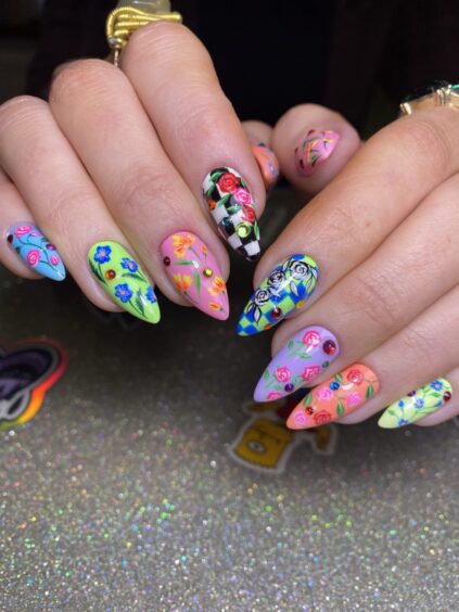 Bright coloured Stilleto nails with vibrant designs and florescent colours.