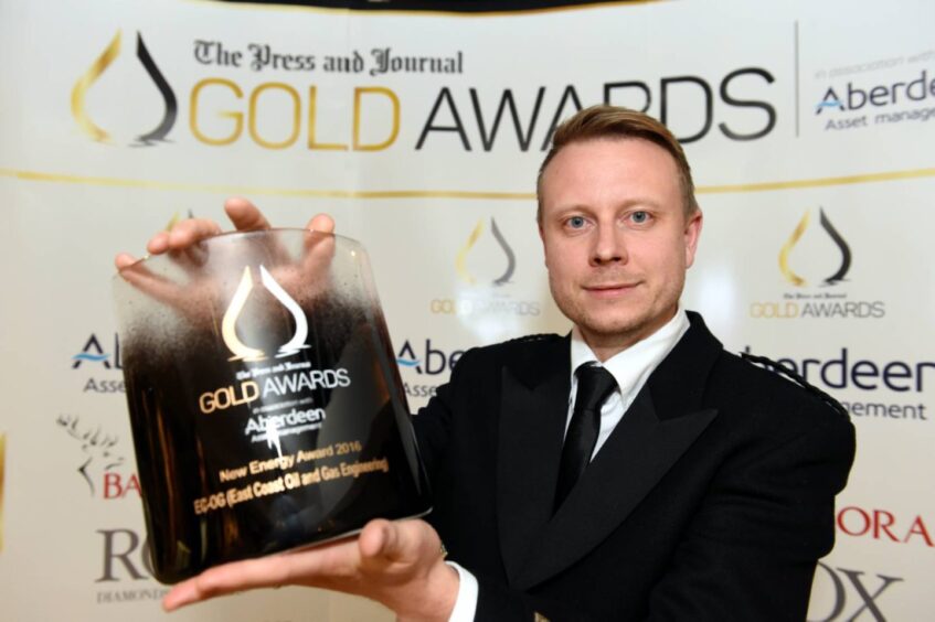 Richard Knox holding aloft the new energy award won by EC-OG, now Verlume, at The Press and Journal Gold Awards in 2016.