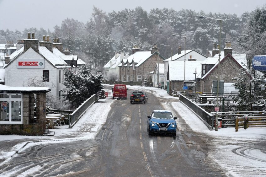 The village of Carr Bridge in the snow. 