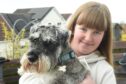 Breagha MacKenzie and her pet dog Murphy, who is now on the mend after his recent scare. Image: Sandy McCook/DC Thomson