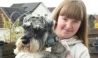 Breagha MacKenzie and her pet dog Murphy, who is now on the mend after his recent scare. Image: Sandy McCook/DC Thomson