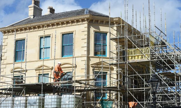 Poundland building in Elgin begins to emerge from behind scaffolding after six years of works