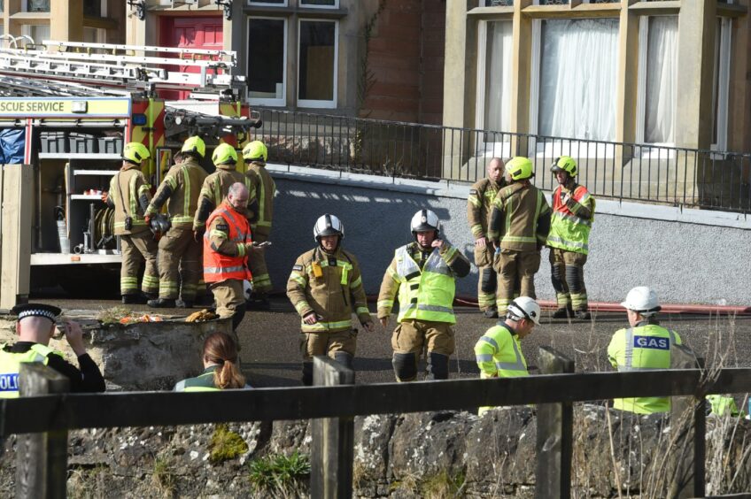 Firefighters on Clachnaharry Road, Inverness, after the fire.