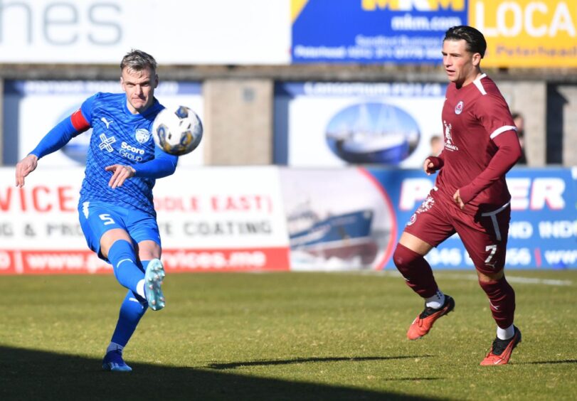 Peterhead captain Jason Brown in action in a League Two match.