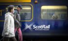 Travellers and Scotrail train.