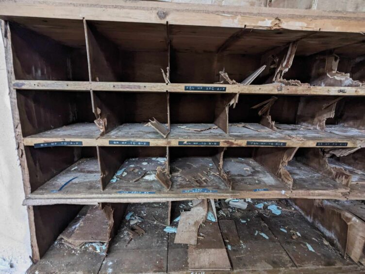 Wooden pigeon holes inside the decaying Stonehaven Radio Station. 