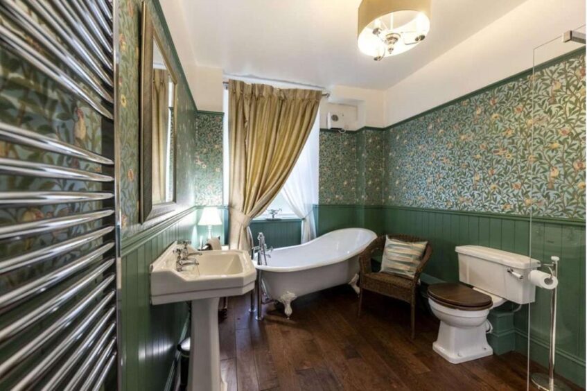 Bathroom decorated with green walls in Tillery House
