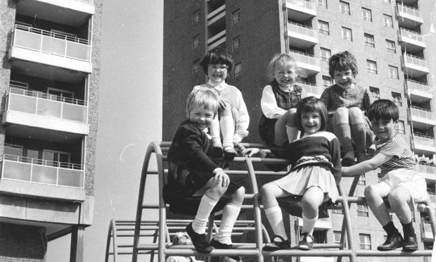 Children playing in the play area of the new blocks of flats in Tillydrone in May 1969. Image: DC Thomson