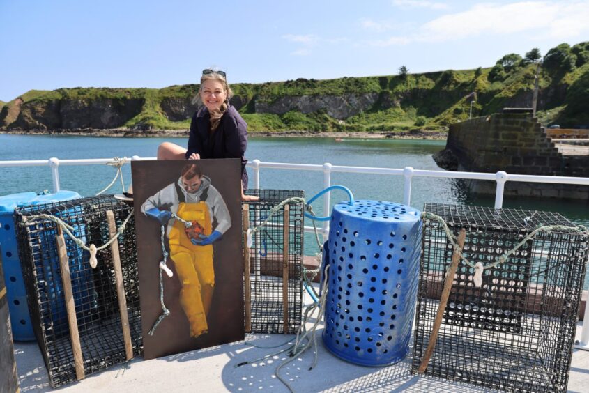 Stephanie Vandem with her piece Fixing the Buoy in Stonehaven.