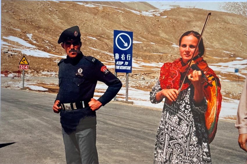 Anne Wood with her violin in Pakistan. 