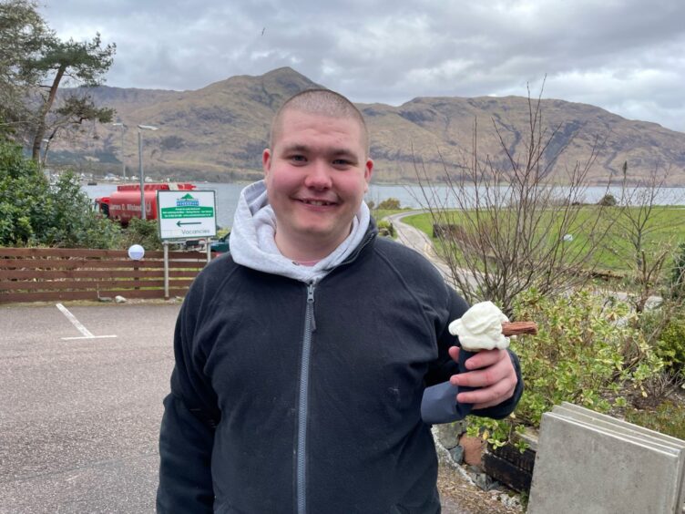 TJ Haining from Ardgour enjoying an ice cream cone with a flake at Conan Ferry.