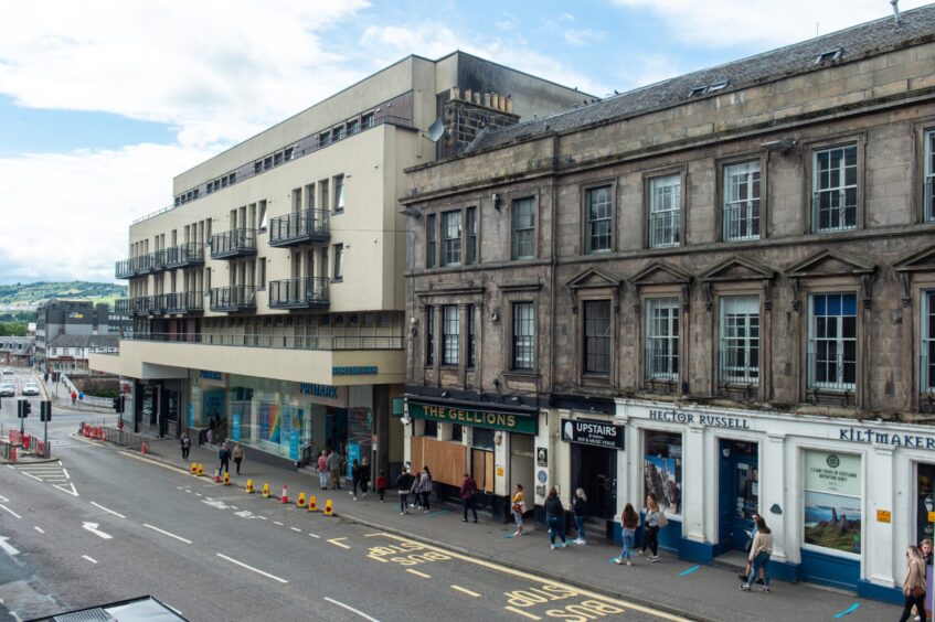 Queue of people next to Primark in Inverness