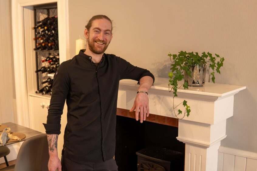 Ross Caitness leaning on the mantlepiece at An Cala Ciuin, his fine dining restaurant at The Mishnish hotel, Tobermory.