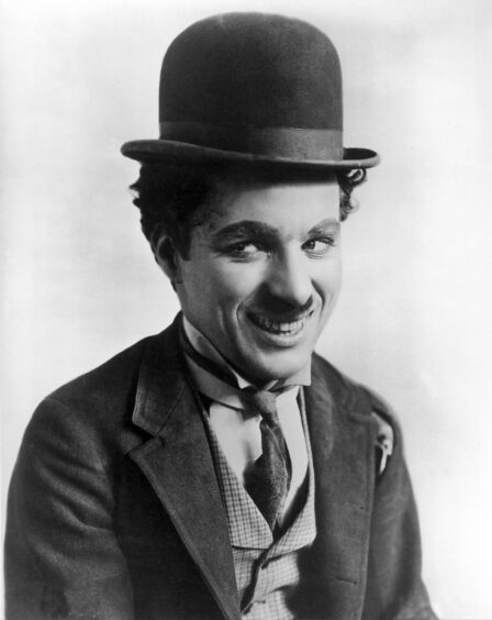 Charlie Chaplin as The Tramp