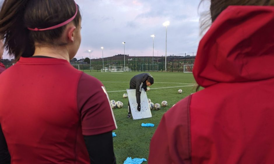 Aberdeen Women manager Clint Lancaster explains a drill at training ahead of their SWPL clash