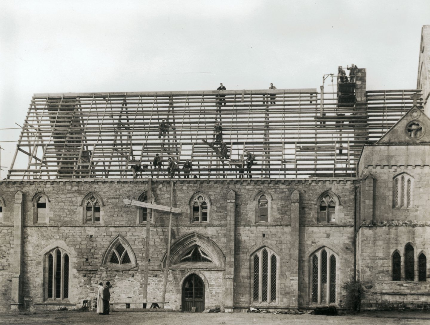 Black and white photo of Pluscarden Abbey roof work. 