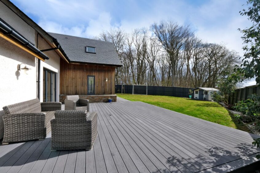 The large decking area and garden at Whitewood.