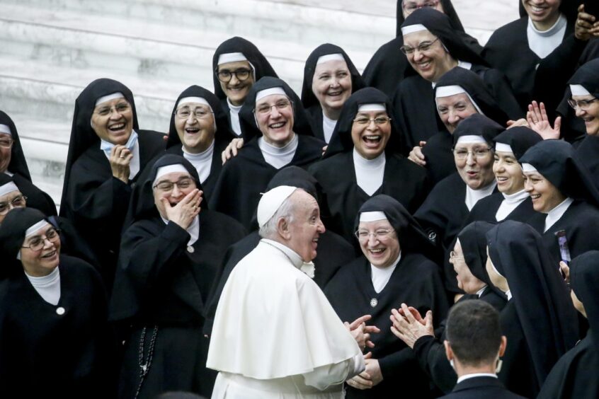 Pope Francis greets a group of nuns during his weekly General Audience in the Paul VI Audience Hall, in Vatican City, October 2021.