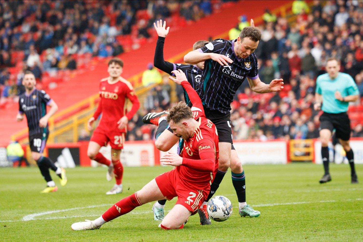 Nicky Devlin (2) of Aberdeen is fouled by St Johnstone Andrew Considine (4), Referee Chris Graham awards a penalty. Image: Shutterstock 