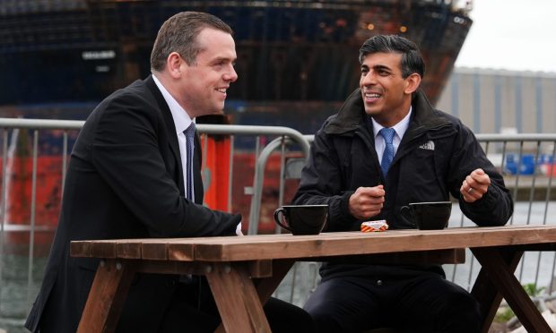 Mandatory Credit: Photo by Stuart Wallace/Shutterstock (14503556ab)
Douglas Ross and Rishi Sunak enjoy a cup of tea in front of an oil platform
Prime Minister Rishi Sunak and Douglas Ross to visit Inverness, Scotland, UK - 23 May 2024