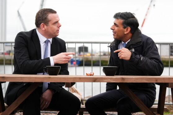 Mandatory Credit: Photo by Stuart Wallace/Shutterstock (14503556al)
Douglas Ross and Rishi Sunak enjoy a cup of tea in front of an oil platform
Prime Minister Rishi Sunak and Douglas Ross to visit Inverness, Scotland, UK - 23 May 2024